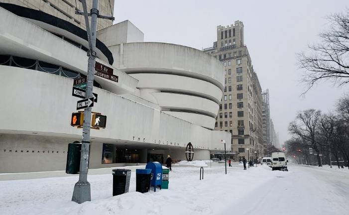 The Guggenheim Museum on Fifth Ave. and E. 89th St. on day of storm (and note the <i>Our Town</i> sidewalk box still standing right next to the US Postal mail box).