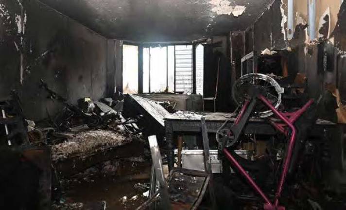 Burned out living room next to bedroom where rope rescues took place. Photo: FDNY Bureau of Fire Investigations
