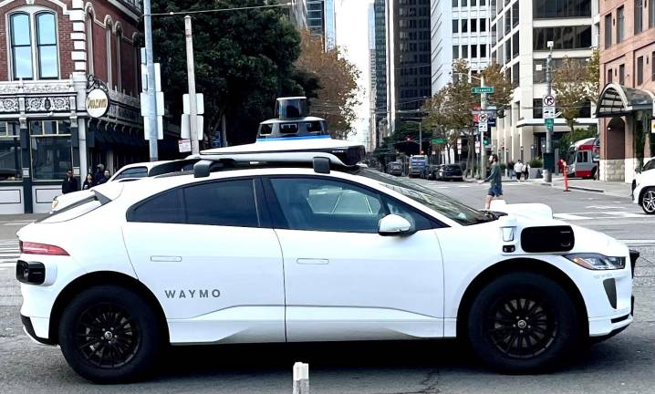 Driverless taxis are being tested in Manhattan and Brooklyn through the end of September by the Waymo subsidiary of Google. For testing, though, the “driverless” cars must have someone in the driver’s seat.
