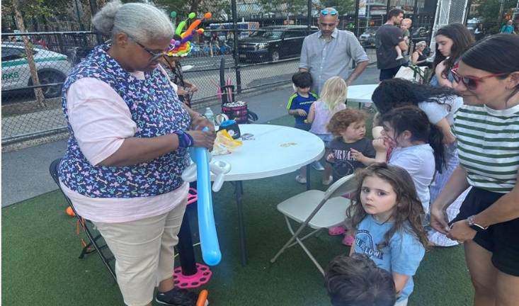 The balloon lady, who goes by Happy Tea, said she’s been fashioning balloons into animals for 30 years.