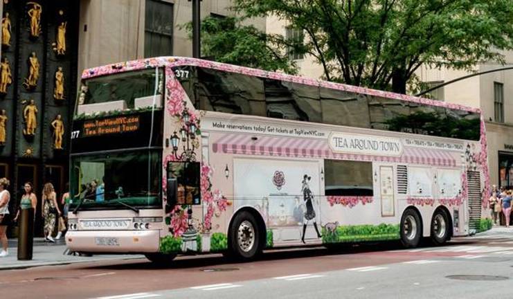 Passengers board the Tea Around Town outside Rockefeller Center enroute to touring city landmarks in their own elegant tearoom on wheels. Photo: Lorraine Duffy Merkl