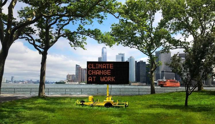 &#8220;Climate Signals,&#8221; a public art installation by Justin Brice Guariglia, consists of solar-powered highway signs in parks across the city displaying messages about climate change. The exhibition, sponsored by the Climate Museum and the Mayor's Office of Climate Policy and Programs, is on display Sept. 1 to Nov. 6. Image courtesy of the Climate Museum.
