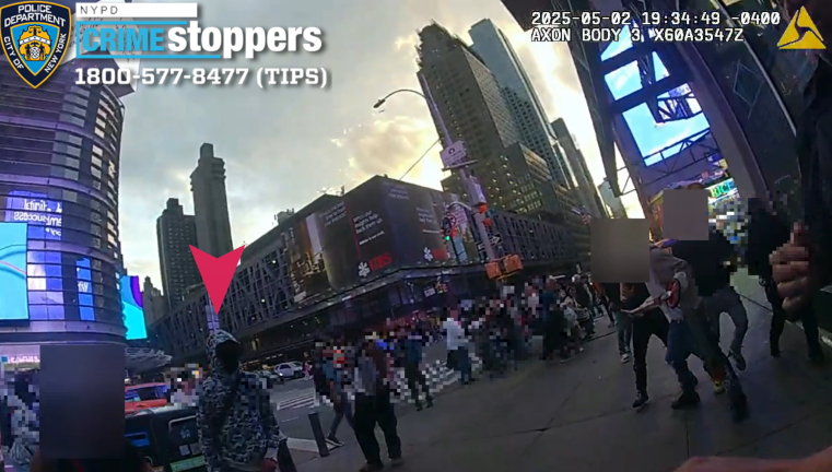 Red arrow marks masked suspect. Northeast corner 42nd St. and 8th Ave. May 2, 2025.