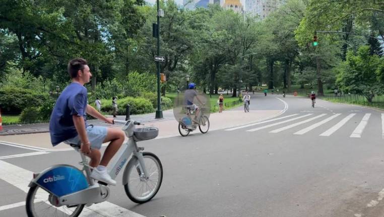 While two pedal assist Citi Bikes are being ridden in the bike lane, another biker can be seen going the wrong way against traffic and in the bike lane recently in Central Park. Despite the reported crackdown on bikers across Manhattan, regulations governing bikes in Central Park are rarely enforced, Straus News has observed.