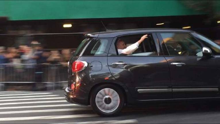 Pope Francis waving to crowds in Manhattan. Photo by Heather Stein