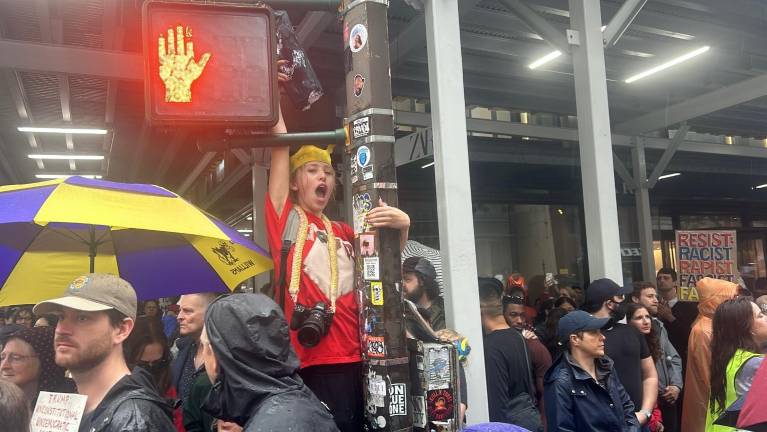 A crowd grew to what organizers said was about 50,000 people in the “No Kings” rally in NYC, part of nationwide protests on June 14.