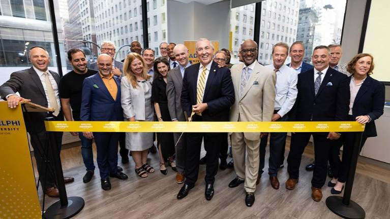 The university celebrated the opening of the new building with Adelphi president Michael A.L. Balbonia cutting the ribbon at an event on June 11.