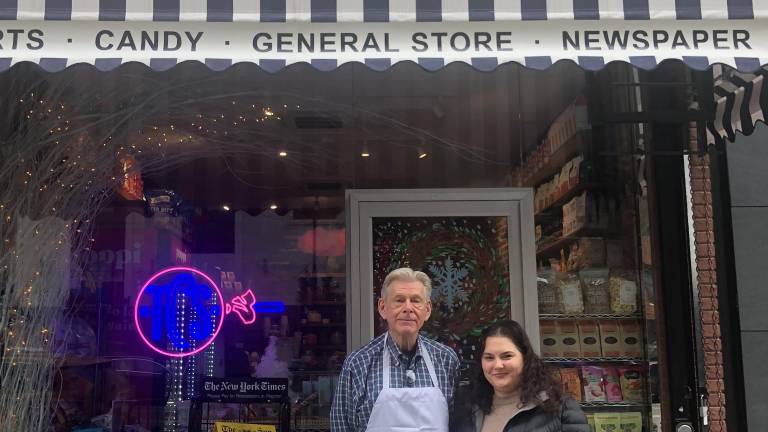 Tom Mazenis (left) and Ariana Philips, along with John Philips, are the entrepreneurs who created The Candy Store, a new name for a treasured local shop.