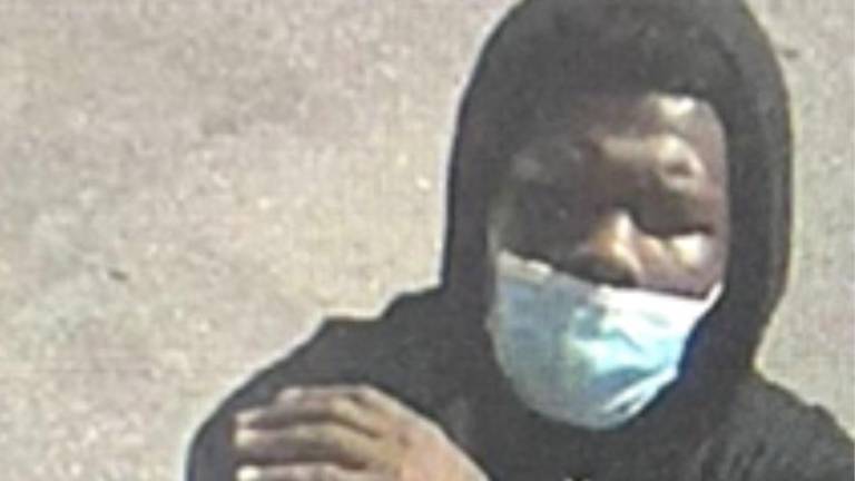 Faisil McCants and his gun on Madison Avenue in East Harlem, Aug. 27, 2025.