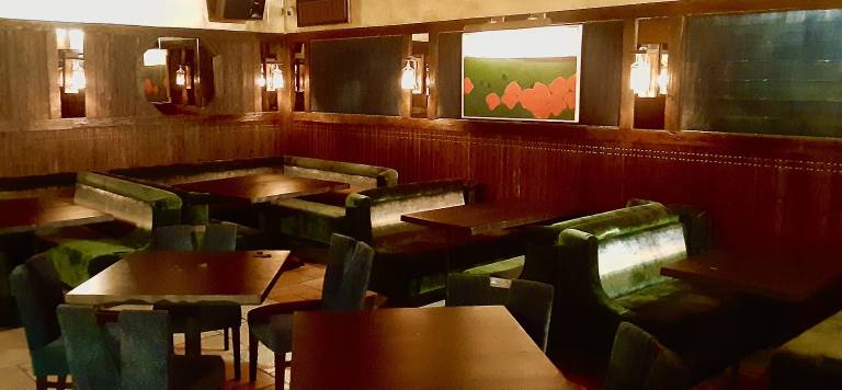 The banquettes at Teruko are covered in deep shades of blue and green.