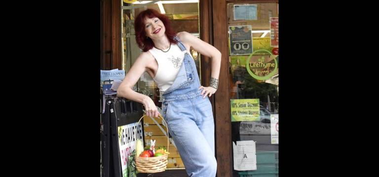 Little white rabbit inspects Karen Rempel’s basket of goodies at LifeThyme.