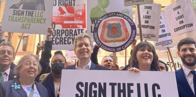 State Senator Brad Hoylman-Sigal and State Assembly Member Emily Gallagher, center, leading a September 27 rally and imploring Governor Kathy Hochul to sign the LLC Transparency Act.