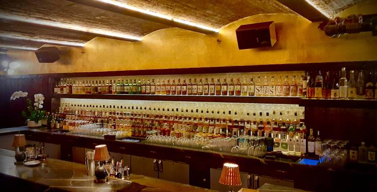 Teruko bar with a shell backbar salvaged from Tokyo’s iconic Orchid Bar showcases its extensive whiskey offerings, said by the owners to be the largest collection of Japanese whiskies in North America.