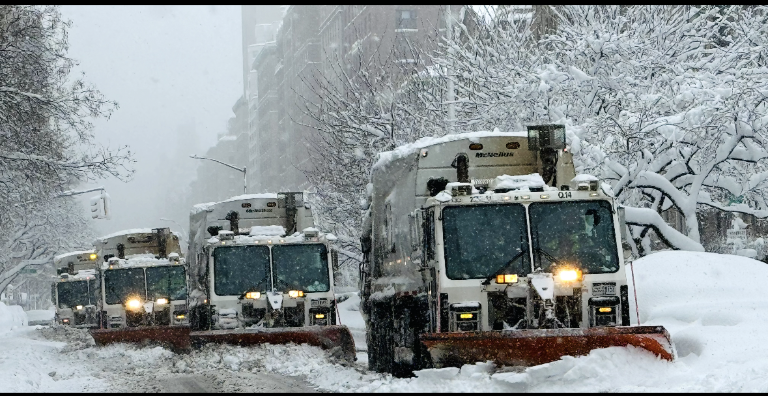A convoy of snow plows hits the Upper East Side.
