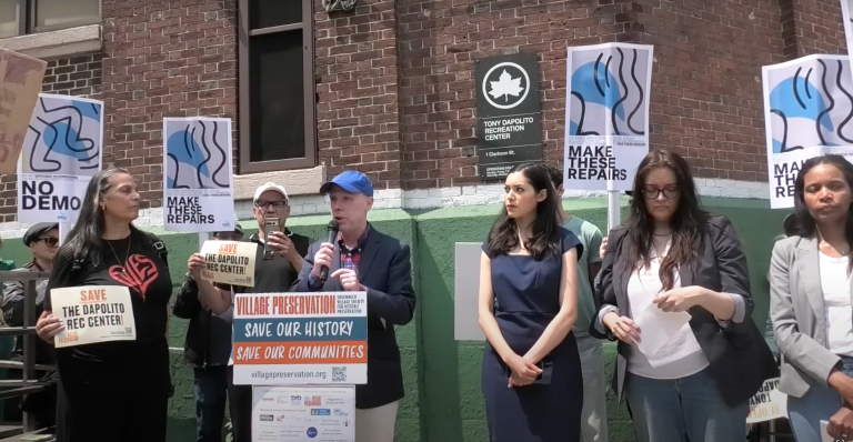 Andrew Berman, head of Village Preservation, leads a June 1 rally outside the historic Tony Dapolito Recreation Center. Rallygoers hoped to convince city officials to reroute $51 million in proposed demolition-and-rebuild funds toward repairs instead.