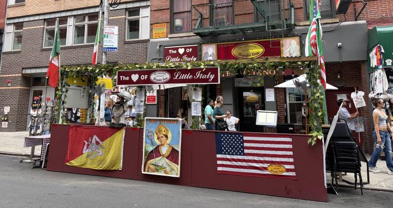 A photo of San Gennaro could be seen outside of a Little Italy restaurant Sept. 2 in anticipation of the start of the 100th anniversary celebration built around the patron saint of Naples, Italy.
