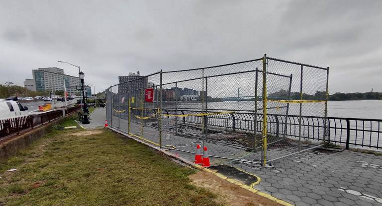 <b>The reopened section of the Esplanade between E 93rd and 94th Street and the sinkhole that remains.</b>