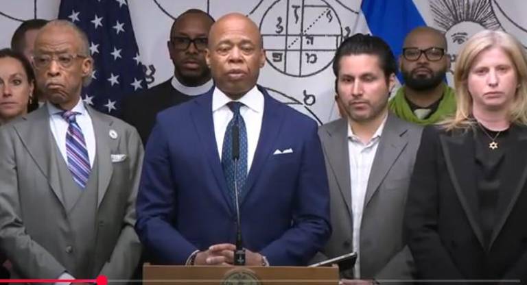 Mayor Eric Adams (center) is joined by Rev. Al Sharpton (left), first deputy mayor Fabien Levy (second from right) , and NYPD Commissioner Jessica Tisch (far right) at a press conference May 22 announcing measures the city is taking to protect Jewish institutions here following the killing of two Israeli embassy workers in DC on May 21.
