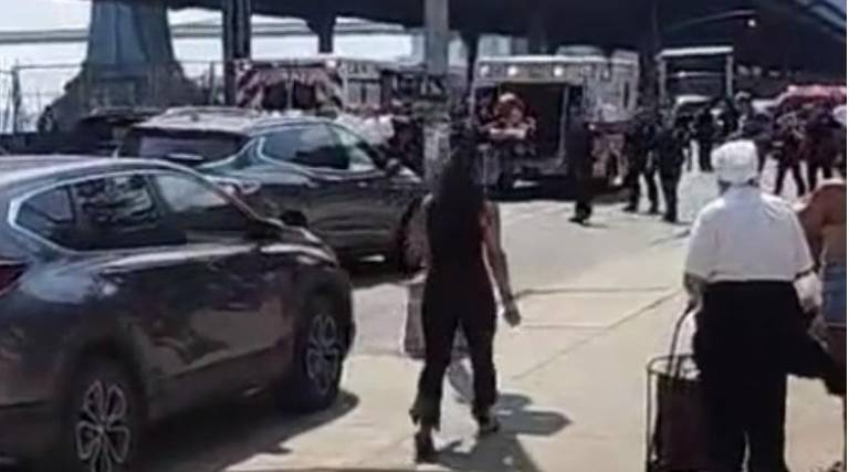 Ismael English being treated by EMS after he jumped off FDR Drive, near the Manhattan Bridge exit. He had went on a crime spree on the highway, stabbing his Lyft driver and attempting to commandeer multiple cars before an unsuccessful escape attempt.