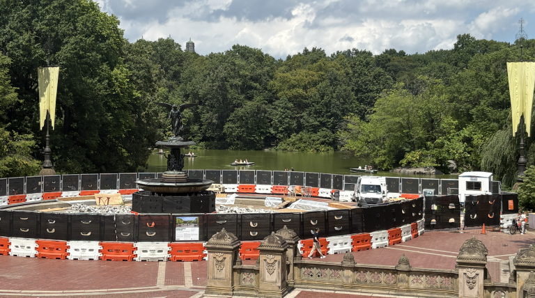 Another angle of the construction, featuring New Yorkers and visitors walking or kayaking in the surrounding areas as normal.