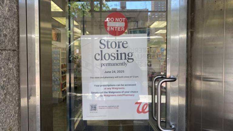 A sign on the door of the Walgreens at 1191 Second Ave. tells of its imminent closing on June 24. Perscriptions will be automatically transferred to a Duane Reade at 1111 Third Ave.