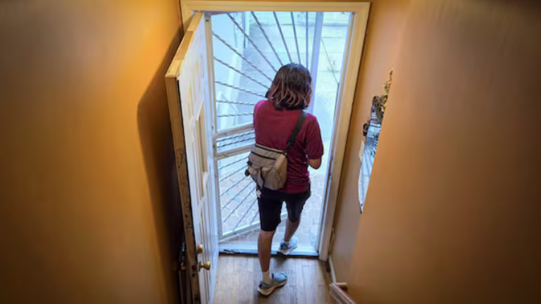 Juan, Margarita’s 18-year-old son, leaves to take his siblings to their first day of school.