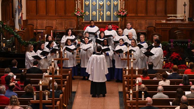 Brick Church Music Director Dr. Raymond Nagem leads the choir in traditional holiday song, including “The Saviour of the World Is Come,” a world premiere composition by Daniel Ficarri.