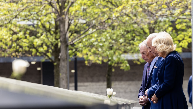 King Charles III (center) and Queen Camilla pay their respects at the reflecting pool at Ground Zero alongside former mayor Michael Bloomberg who is the chairman of the 9/11 Memorial and Museum.