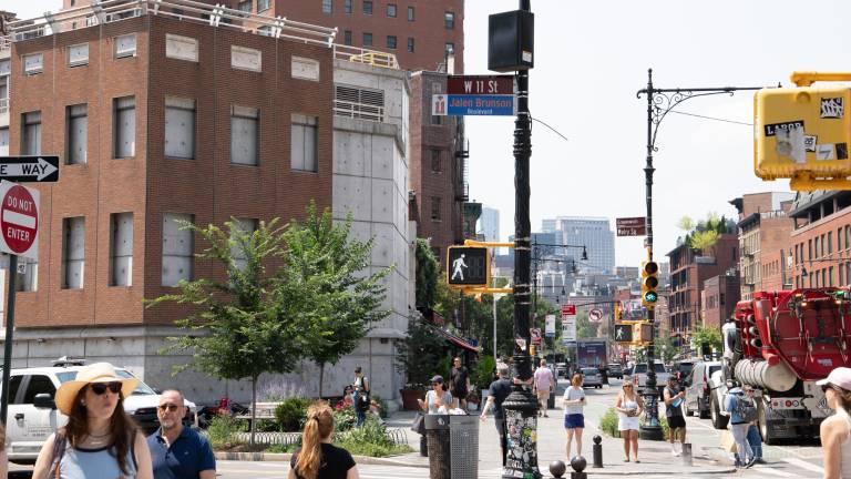 The Jalen Brunson street sign at West 11th Street and Seventh Avenue is considerably higher than the honorary signs for his teammates.