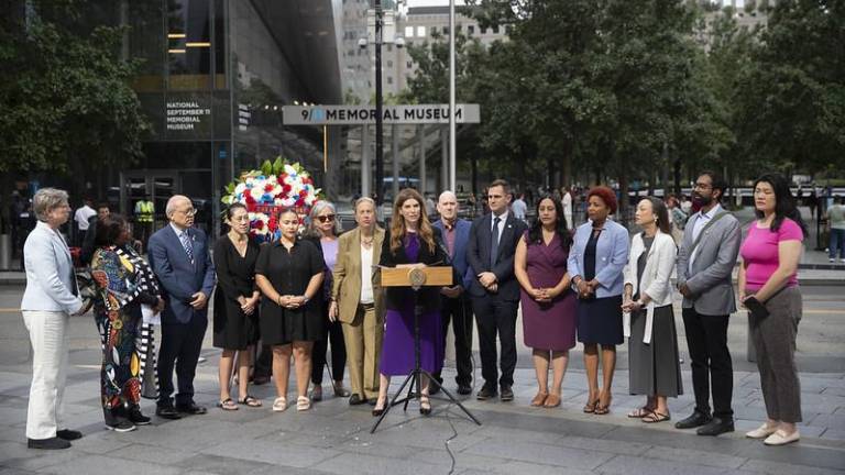 Speaker Julie Menin joins other elected representatives to reveal a $1 million funding initiative from the City Council for the 9/11 Memorial Museum and Tours exhibition.