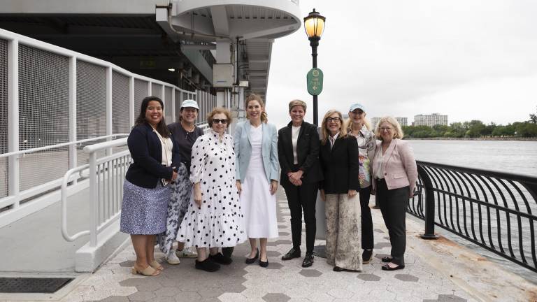 City Council Speaker Julie Menin (pictured center, blue) and NYC Parks Commissioner Tricia Shimamura (pictured far-left) are hailing the partial reopening of the East River Esplanade which will now allow access up to East 73rd Street.