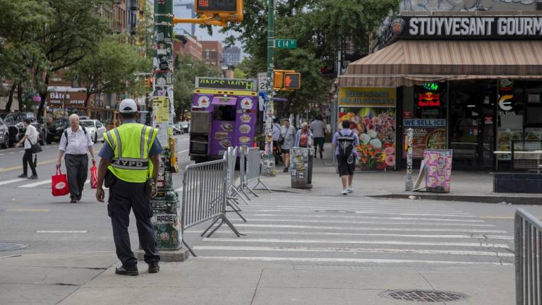 NYPD and NYC Transit officials stood by the enclosed entrance to First Avenue on 14 Street, redirecting vehicles away from the zone.