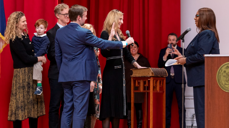 New York State Attorney General swears in Virginia Maloney, who places her right hand on a family bible that is more than 200 years old in a ceremonial swearing in at Hunter College on Jan 31.