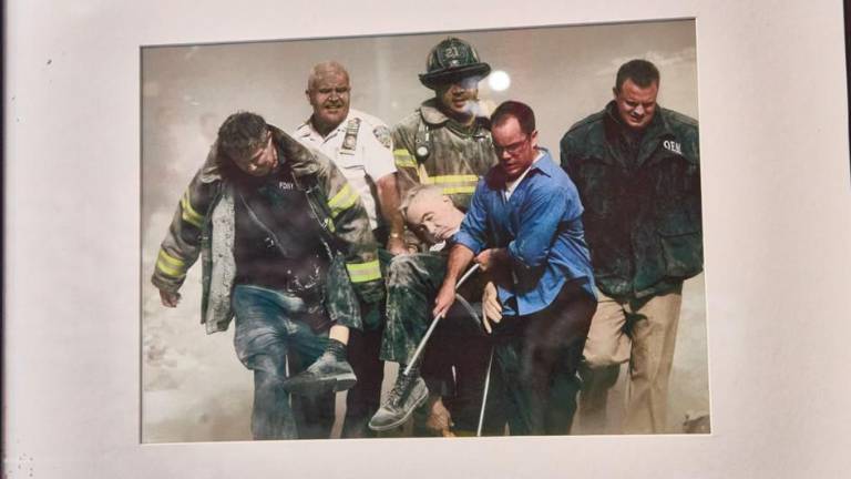 On display at the Fire Museum: the 9/11 photo by Shannon Stapleton of the body of FDNY chaplain Father Mychal Judge carried by firefighters Christian Vaughn and Zachary Vause; NYPD Lt. William Cosgrove; Kevin Allen of the Office of Emergency Management and civilian John Maguire from Goldman Sachs.