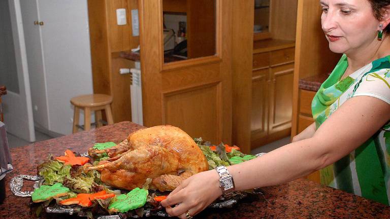 A Christmas table by Elaine Lloyd. Turkey is the most popular bird to adorn a Christmas feast in the US and Britain. But it is far from the old delight, the Christmas goose.