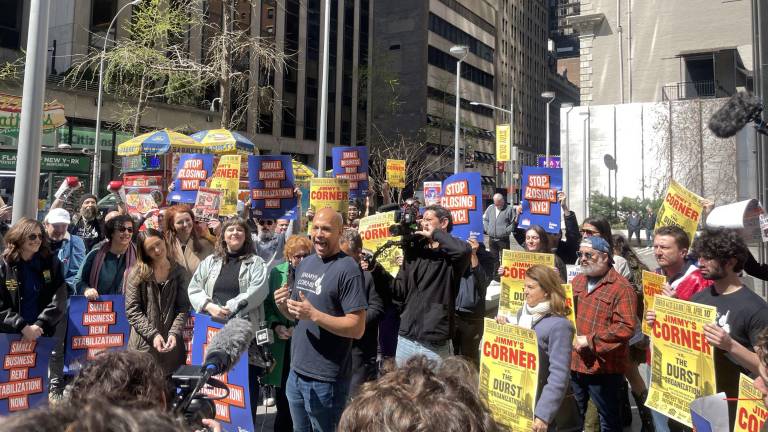 Jimmy’s Corner owner Adam Glenn (center-right), who inherited the dive bar from his late boxing legend father, rallied against a planned eviction of his business by the Durst Organization on April 10.