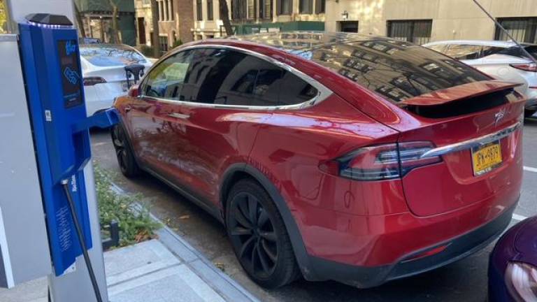 Yet another Tesla that has taken the charging spot without using the charger. Photo: Tom Goodman