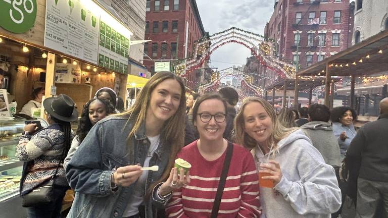 Attendees enjoy Figo gelato at the Feast of San Gennaro on Sept. 25 before the weekend rain.