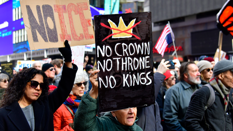Handwritten signs proclaiming “No Ice” and “No Kings” were in abundance as were American flags, some flying upside down in an international distress symbol.