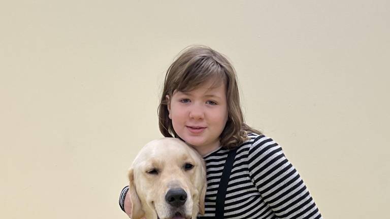 Ten-year-old Naomi Wood is two years into her recovery from brain cancer. Post surgery and treatment at Memorial Sloan Kettering Cancer Hospital, Naomi is taking things one step at a time, with her golden retriever service dog, Elroy, by her side.