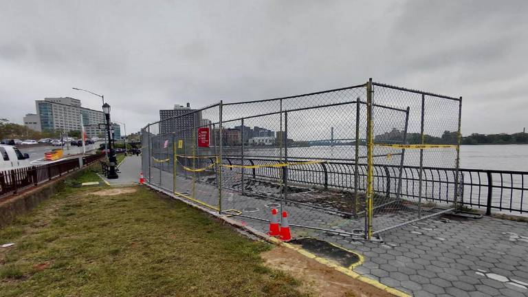 <b>The reopened section of the Esplanade between E 93rd and 94th Street and the sinkhole that remains.</b>