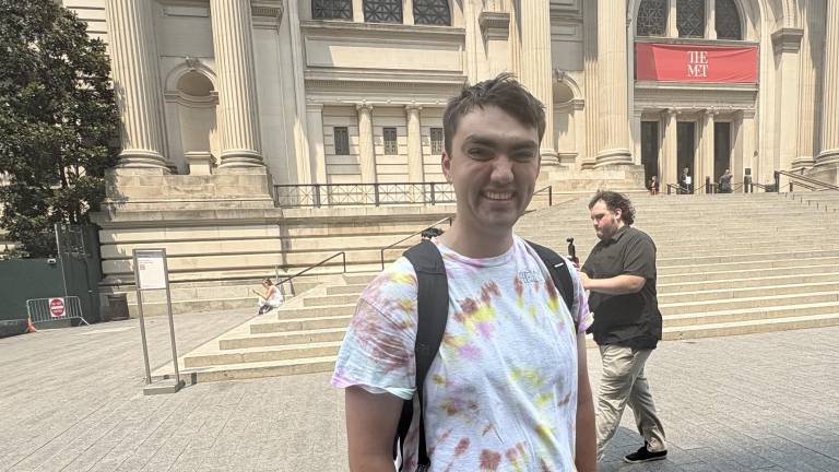 Joey Johnson, creator of the Instagram and TikTok account @<a rel=nofollow noopener noreferrer href=https://www.instagram.com/herbshotdogreviews/ target=_blank>herbshotdogreviews</a> gets ready to review a hot dog from Smash Kitchen at a pop-up to promote National Hot Dog Day. He gave it a rave review.